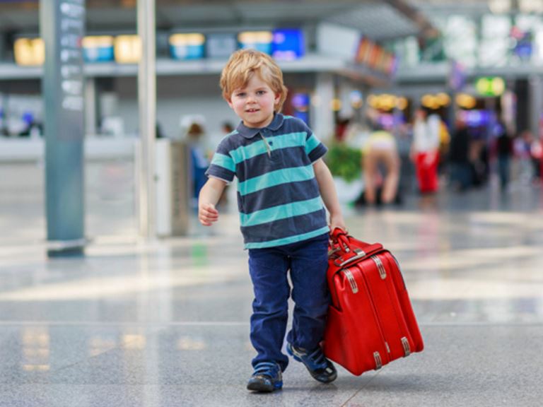 Boy is ready for his flight - 5 Food Tips for Traveling with Kids