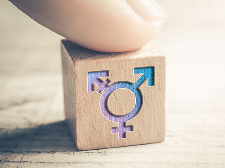 transgender symbol on wooden block